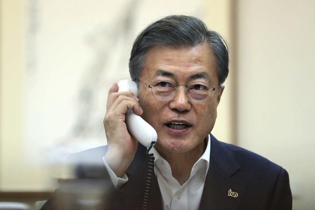 South Korean President Moon Jae-in talks on the phone with US President Donald Trump at the presidential Blue House in Seoul. Photo: AP