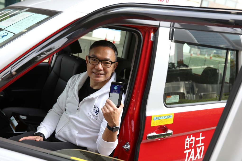 Paul Tse, a legislator and chairman of Easy Planet, shows off the new SuperCap taxi-hailing app last week. Photo: Nora Tam