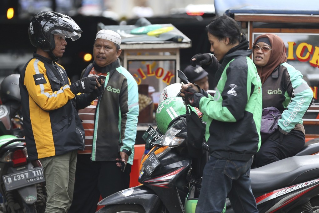 Uber and Grab riders in Jakarta, Indonesia, before Ubert left the Southeast Asian market. Photo: AP