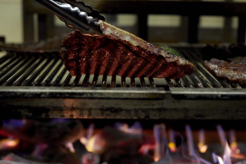 Diners at Mr Brown can watch the chefs prepare the meat in the open kitchen.