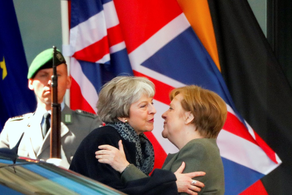 German Chancellor Angela Merkel (right) kisses British Prime Minister Theresa May as she leaves after they met to discuss Brexit, at the chancellery in Berlin, Germany on Tuesday, April 9, 2019. Photo: Reuters