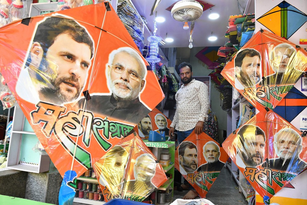 A shop assistant sells kites bearing images of the Indian political rivals, Prime Minister Narendra Modi and Congress President Rahul Gandhi in Bangalore. Photo: AFP