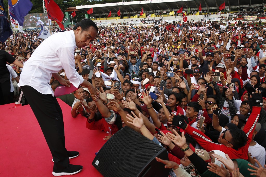 President Joko Widodo meeting supporters at a campaign rally. Photo: EPA-EFE