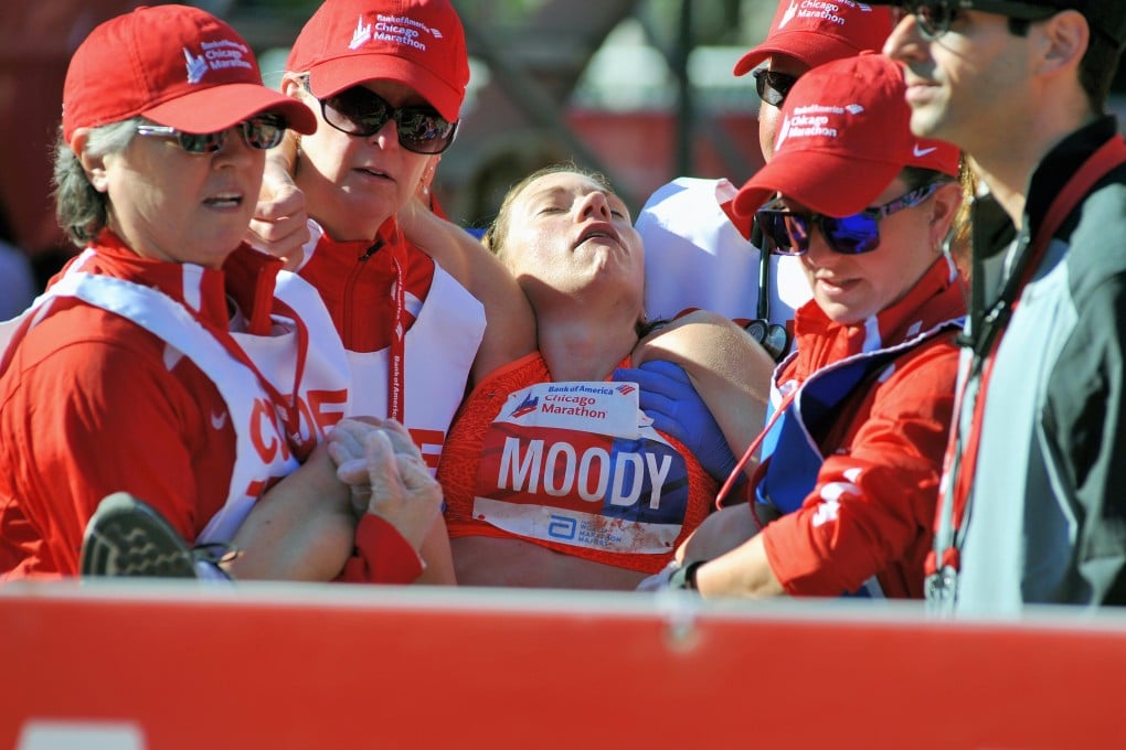 American athlete Tera Moody is carried off when she collapses after finishing the Chicago Marathon in 2015. Photo: Alamy