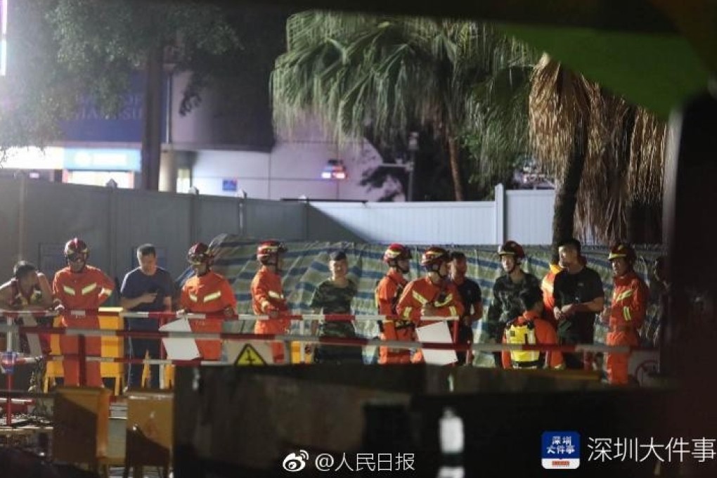 Rescuers and engineers work to recover the dead after flash flooding in Shenzhen swept drainage crews away. Photo: Weibo