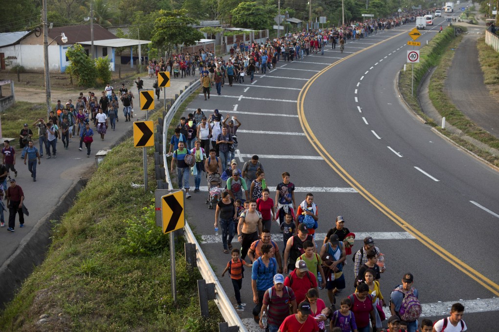 Central American migrants walk on the shoulder of a road in Frontera Hidalgo, Mexico, on Friday, April 12, 2019. Photo: AP