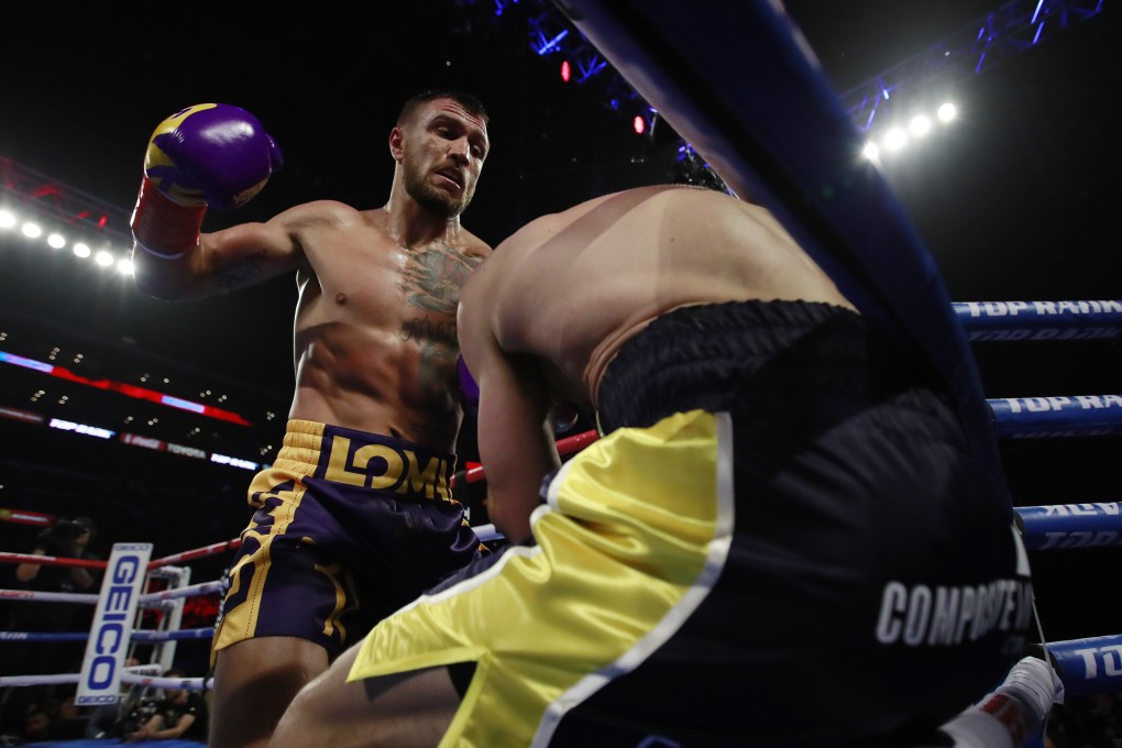 Vasyl Lomachenko has Anthony Crolla up against the ropes. Photo: Reuters