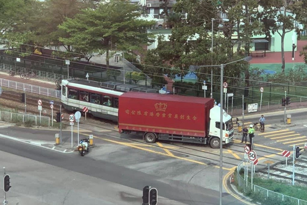 A light rail train and a medium-sized truck collided on Sunday morning on a crossing at Tin Ha Road, near Chung Uk Tsuen. Photo: Facebook