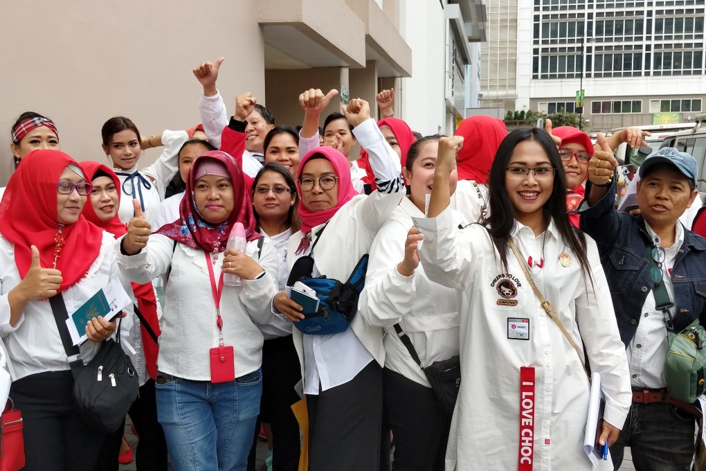 Hundreds of Indonesians living in Hong Kong queue outside Queen Elizabeth Stadium in Wan Chai to participate in the 2019 presidential and parliamentary elections. Photo: Sum Lok-kei
