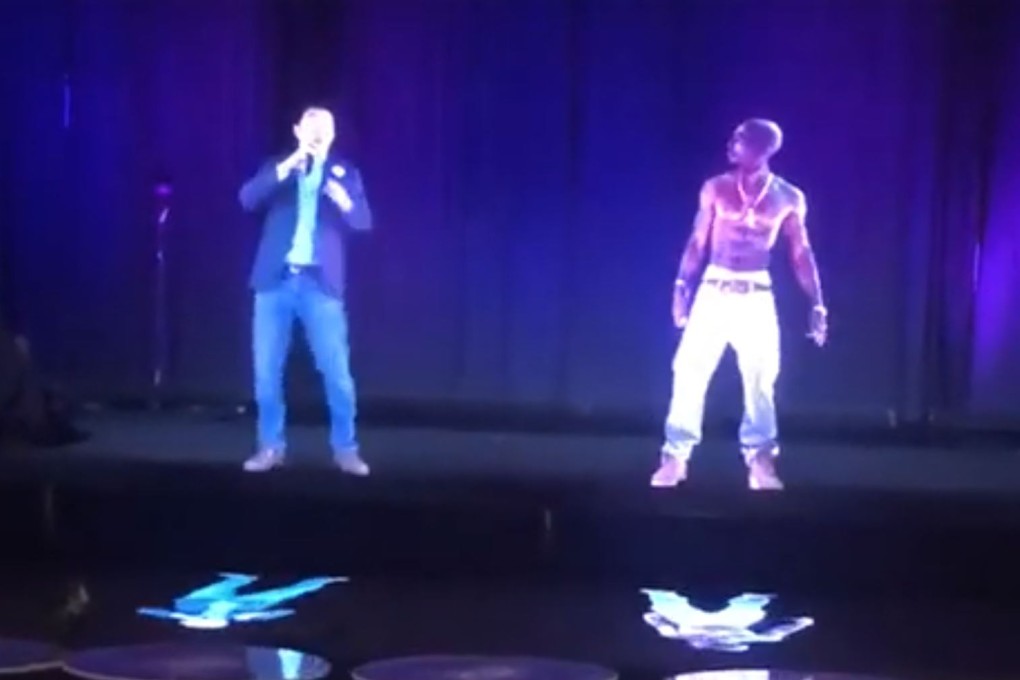 US presidential hopeful Andrew Yang rehearses with a hologram of rapper Tupac Shakur using his own hologram in April 2019. Photo: AJ Seguro via YouTube