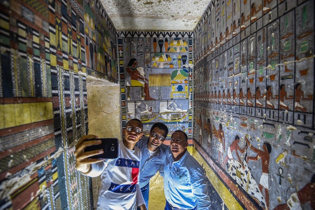 Mohamed Mujahid, head of the Egyptian mission which discovered the tomb of the ancient Egyptian nobleman “Khewi”, takes a selfie. The tomb at the Saqqara necropolis dates back to the 5th dynasty (2494-2345 BC). Photo: AFP