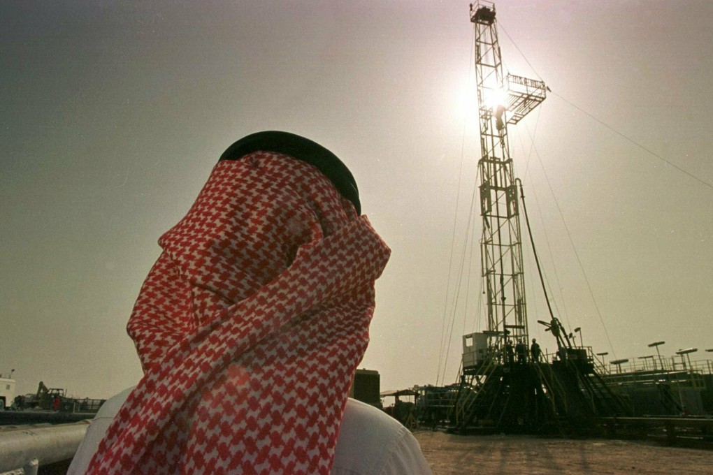 Khaled al-Otaiby, an official of the Saudi oil company Aramco, watches progress at a rig at the al-Howta oilfield near Howta, Saudi Arabia. Photo: AP Photo
