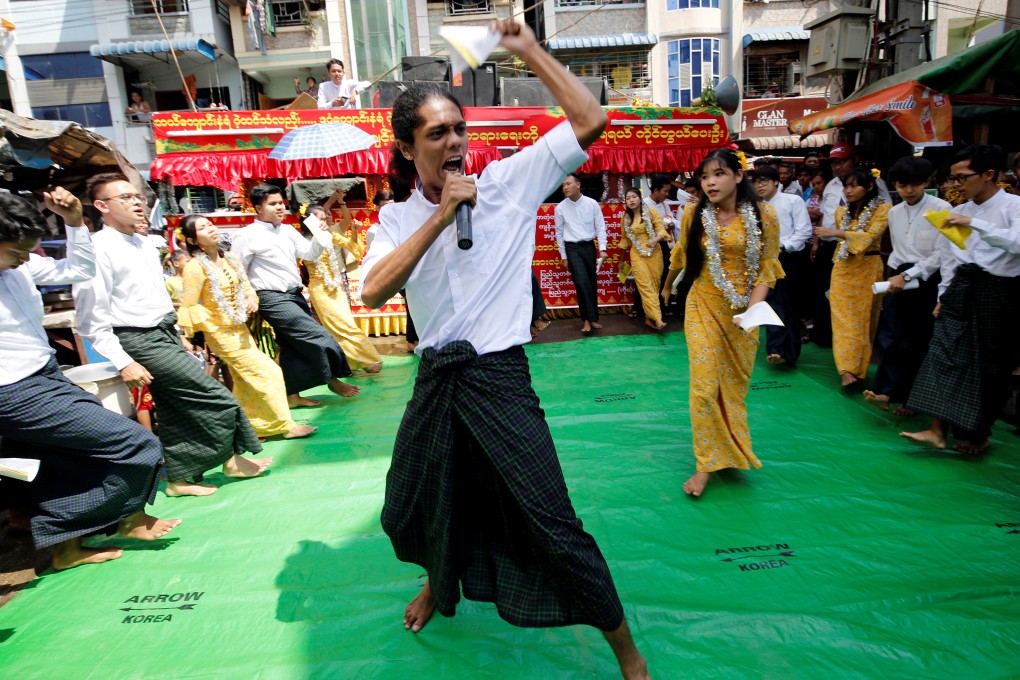Students from Dagon University perform traditional slam poetry or thangyat during Burmese New Year in Yangon. Photo: Reuters