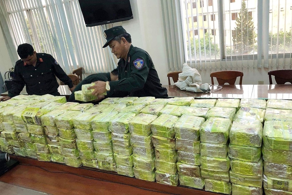 Vietnamese police arrange seized methamphetamine at a police station in Ho Chi Minh City after a huge drug bust in March. The latest bust was more than half a tonne. Photo AFP