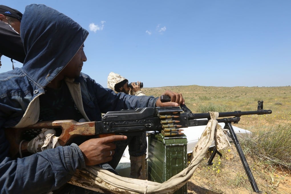 Fighters loyal to Libya's Government of National Accord (GNA) hold a position west of the city of Aziziah, some 60 kilometres (37 miles) southwest of the capital Tripoli. Photo: AFP