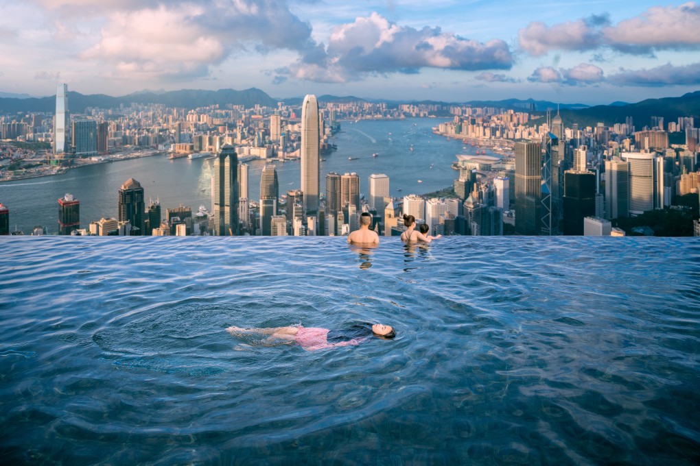 A roof top swimming pool in a luxury hotel overlooking Hong Kong’s city skyline. Photo: Shutterstock