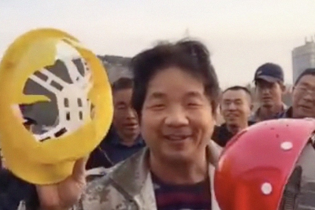 A Chinese construction worker’s video of him easily smashing his safety hat with another one has raised concerns about standards of protective headgear. Photo: Weibo