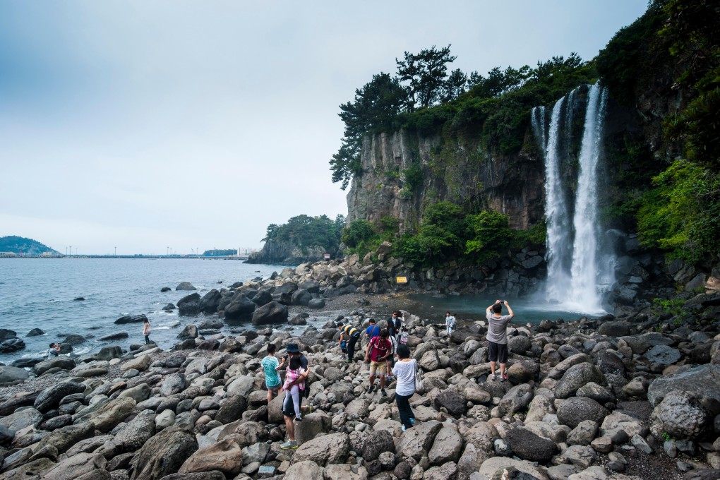 Jeongbang Pogpo, a waterfall, on the South Korean island of Jeju, where a legendary Chinese alchemist was said to have landed while in search of the elixir of life some 2,000 years ago. Photo: Alamy