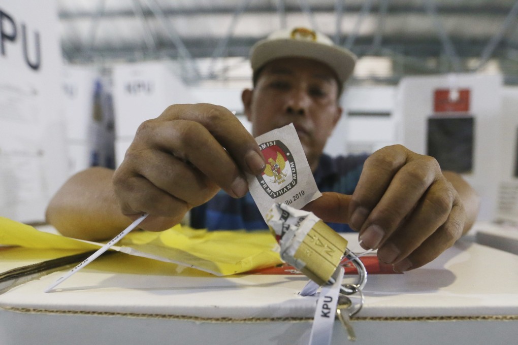 A worker prepares a ballot box to be distributed to polling stations in Jakarta. Photo: AP