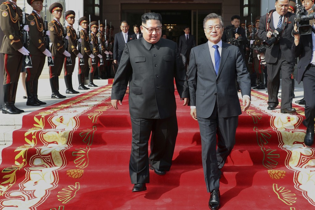 North Korean leader Kim Jong-un walks with South Korea President Moon Jae-in after their meeting at the northern side of Panmunjom in North Korea in March 2018. Photo: South Korea Presidential Blue House via AP