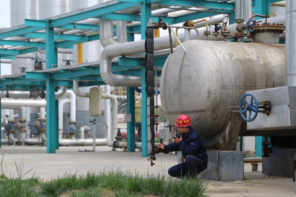 An employee works inside a factory of Chinese state-owned enterprise Pingmei Shenma Group in Baofeng County, Henan province, China. Photo: Reuters