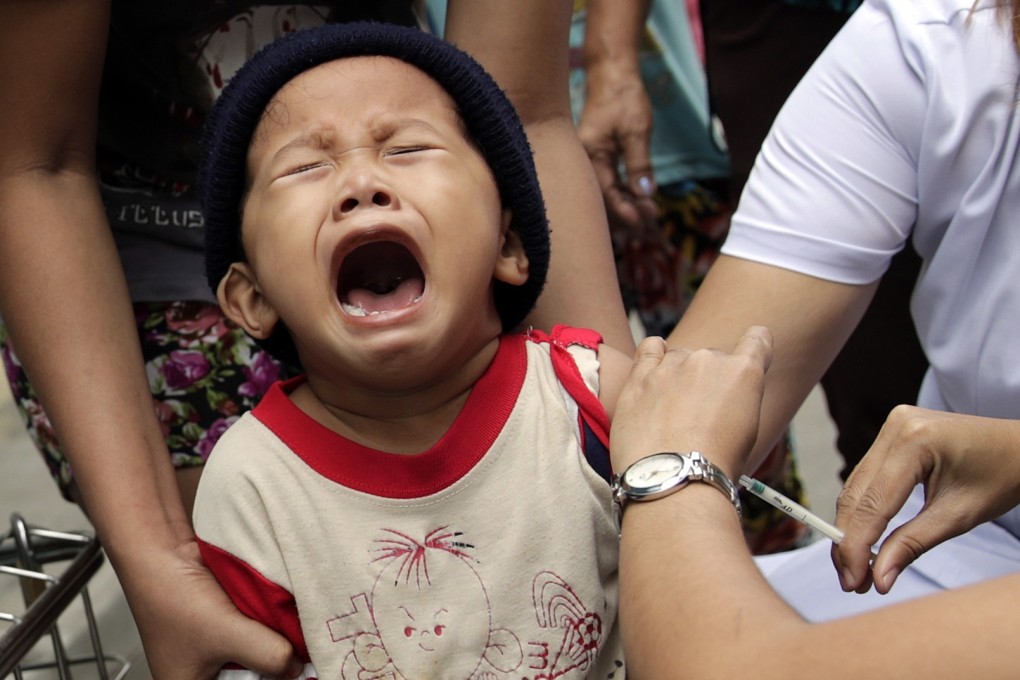 A boy in Las Pinas City in the Philippines receive a measles vaccine during a nationwide immunisation programme in February. Photo: EPA-EFE