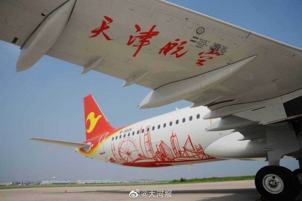 Tianjin Airlines was forced to put passengers on another plane after a woman tossed six coins into a plane engine for good luck on Monday. Photo: Weibo