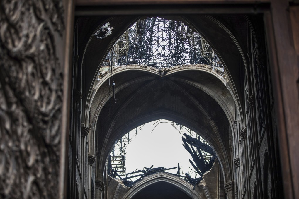 A hole is seen in the dome inside the damaged Notre Dame cathedral in Paris. Photo: AP