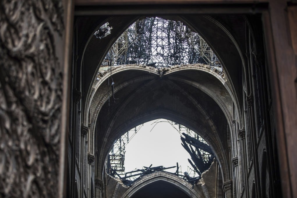 A hole is seen in the dome inside the damaged Notre Dame cathedral in Paris. Photo: AP