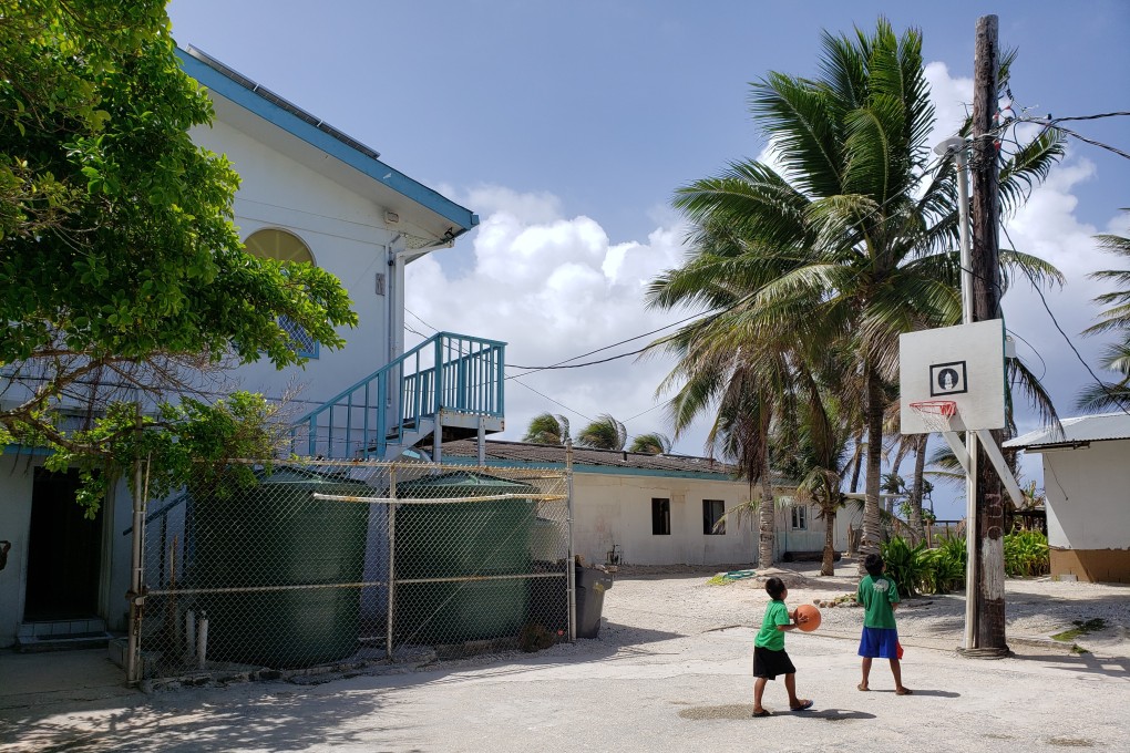 Children play basketball in the court next to the Marshall Islands' only mosque. Photo: Sajid Iqbal