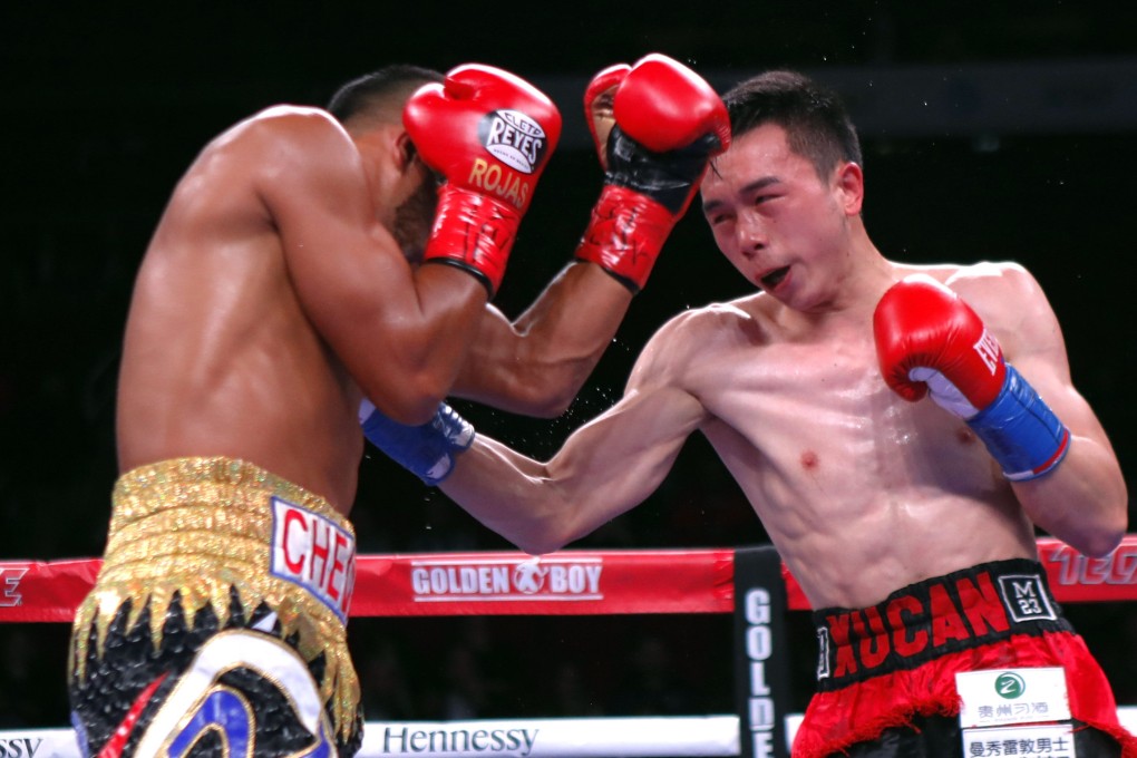 China’s Xu Can (right) on his way to victory against Puerto Rico’s Jesus Rojas for the WBA featherweight title in Houston, Texas in January. Photo: Xinhua