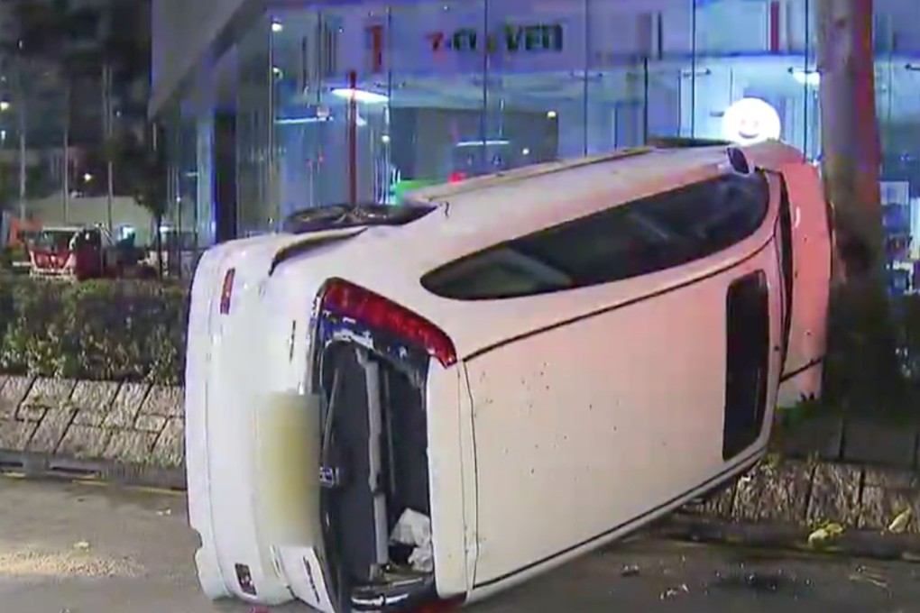 The scene of the incident, after the white car had flipped on its side following a chase. Photo: TVB News