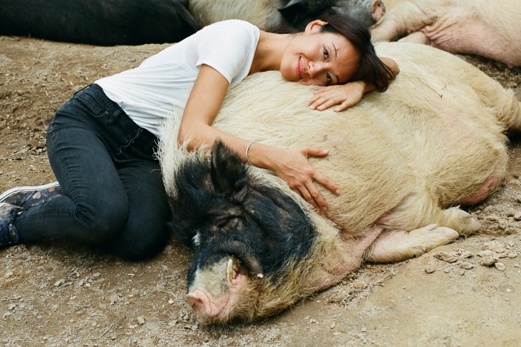 Justine Kwok, founder of Flow, the experiential farm and animal sanctuary in Zhongshan, in China’s Guangdong province, with ‘resident’ Dong Dong the pig. Photo: Abdela Igmirien