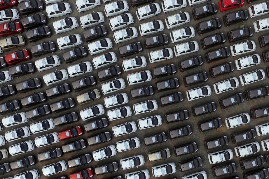 Electric cars are seen at a parking lot of a car factory in Xingtai, Hebei province. KPMG says electric car makers face tighter capital markets and challenges to build consumer trust in the world’s largest car market. Photo: Reuters