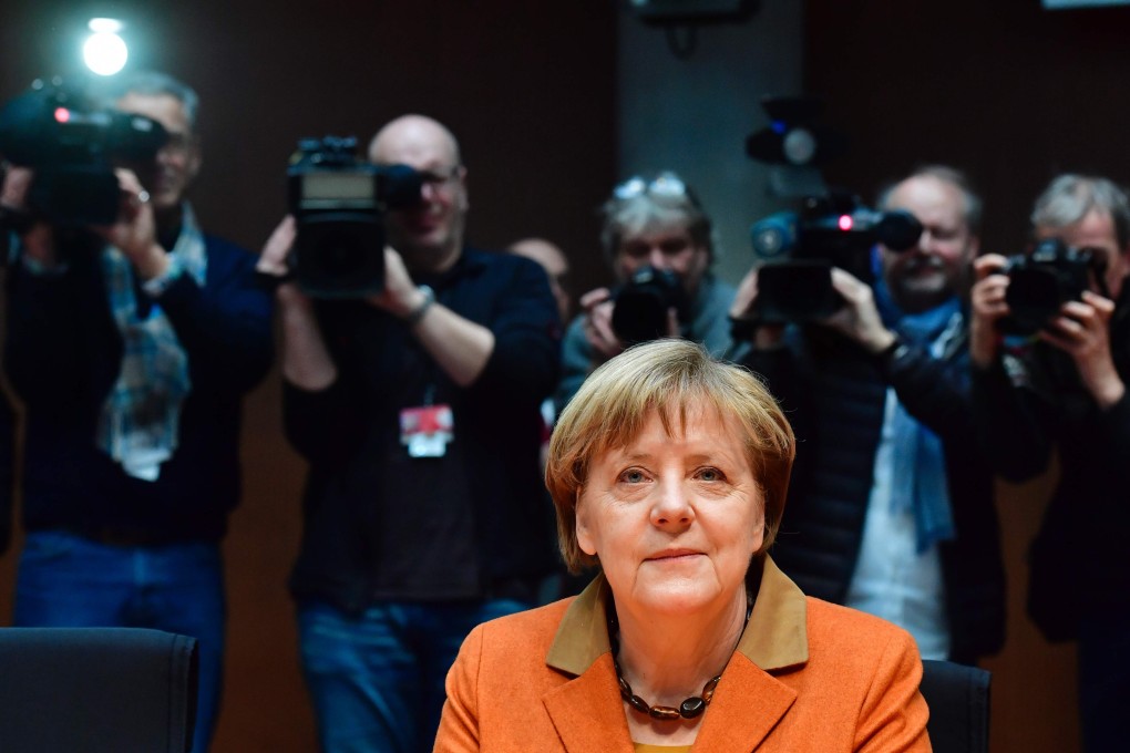 German Chancellor Angela Merkel is in the focus of cameramen and photographers as she waits on February 16, 2017 in Berlin to face a closed-door hearing by a parliamentary enquiry looking into revelations of the sweeping surveillance activities of the US intelligence service NSA and into the extent of its cooperation with German's BND foreign intelligence service. Photo: AFP