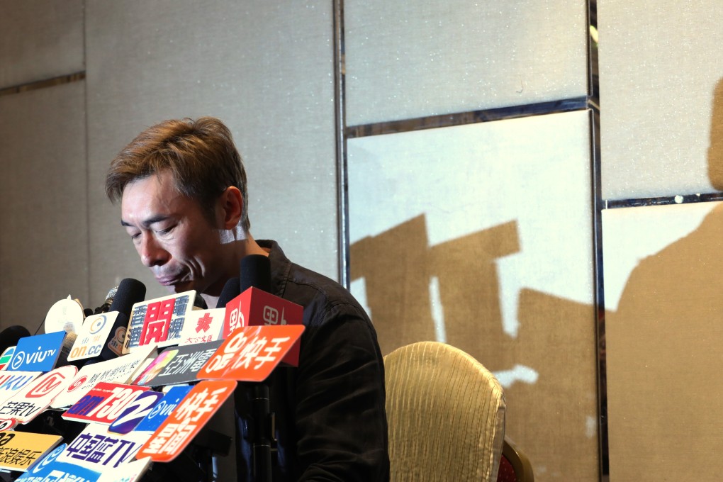 A tearful Andy Hui faces the press after the release of a video showing him and actress Jacqueline Wong kissing in the back of a car. Photo: Felix Wong