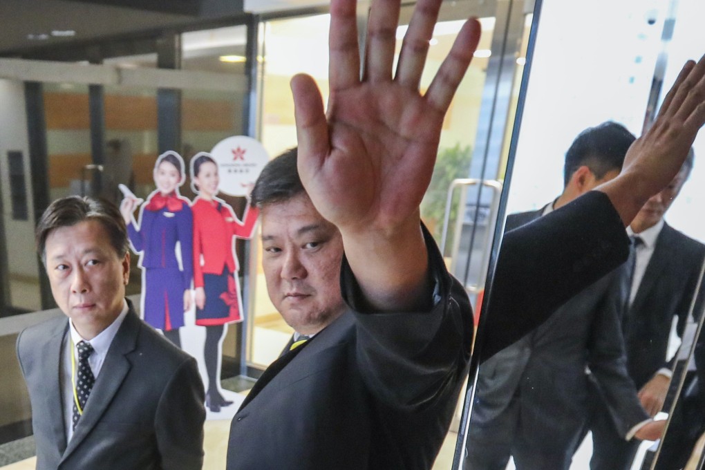 Security guards are stationed outside the Hong Kong Airlines office in Tung Chung. Photo: Felix Wong