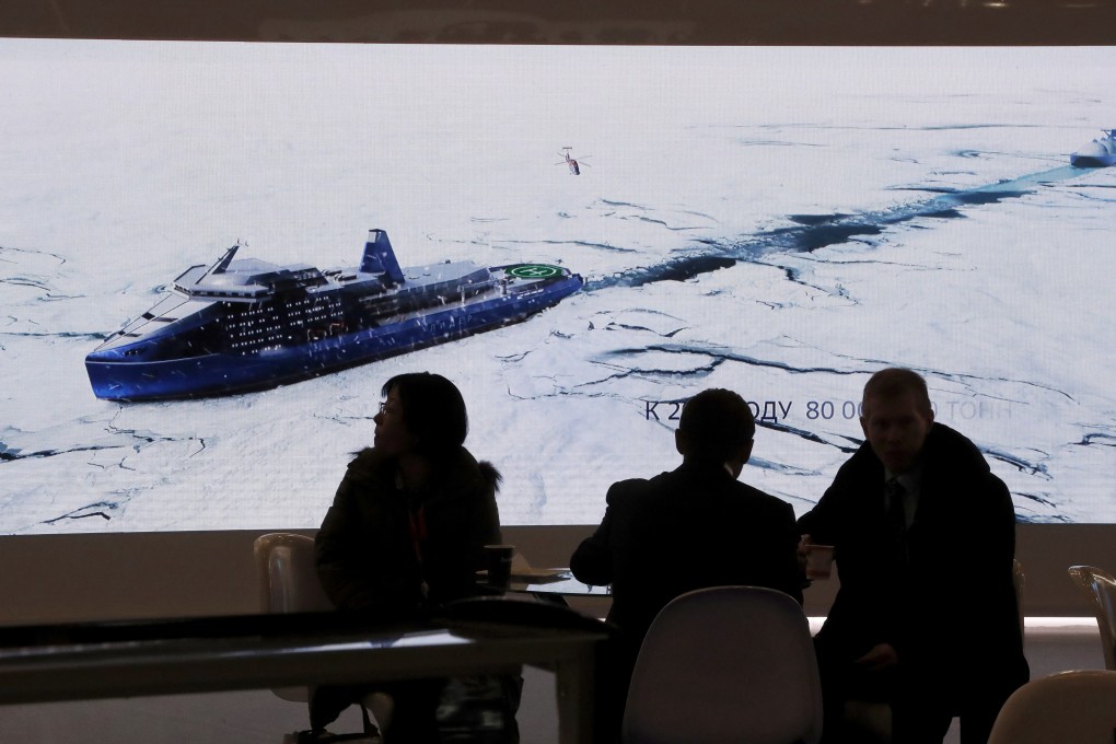 Delegates watch footage of an icebreaker at the International Arctic Forum in Russia earlier this month. Photo: EPA-EFE
