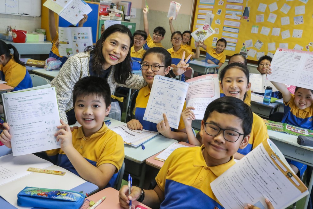 The principal and students at a Tai Po school celebrate freeing up afternoon lessons so children can complete their homework in class and not bring work home, in October 2018. Photo: K.Y. Cheng