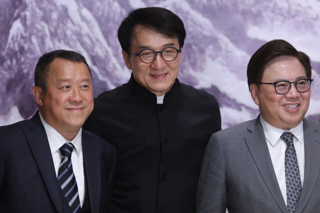 From left, Eric Tsang, Jackie Chan and Wilfred Wong speak to the press in Beijing. Photo: Simon Song