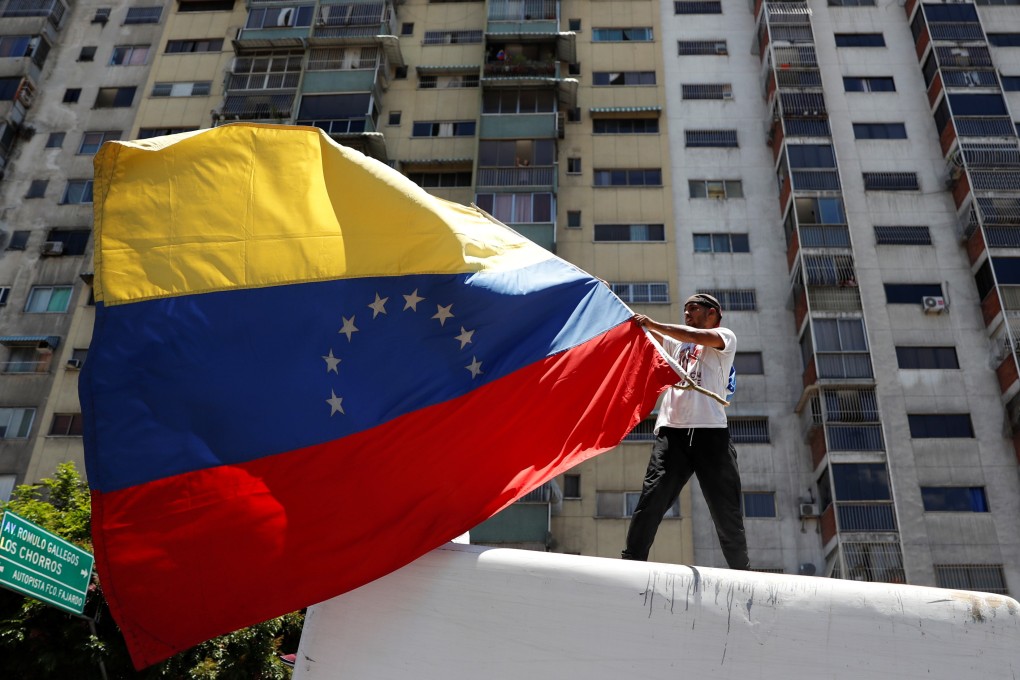 A supporter of Venezuelan opposition leader Juan Guaidó, whom many nations have recognised as the country’s rightful interim ruler, takes part in a rally against President Nicolas Maduro’s government in Caracas on April 6. Photo: Reuters