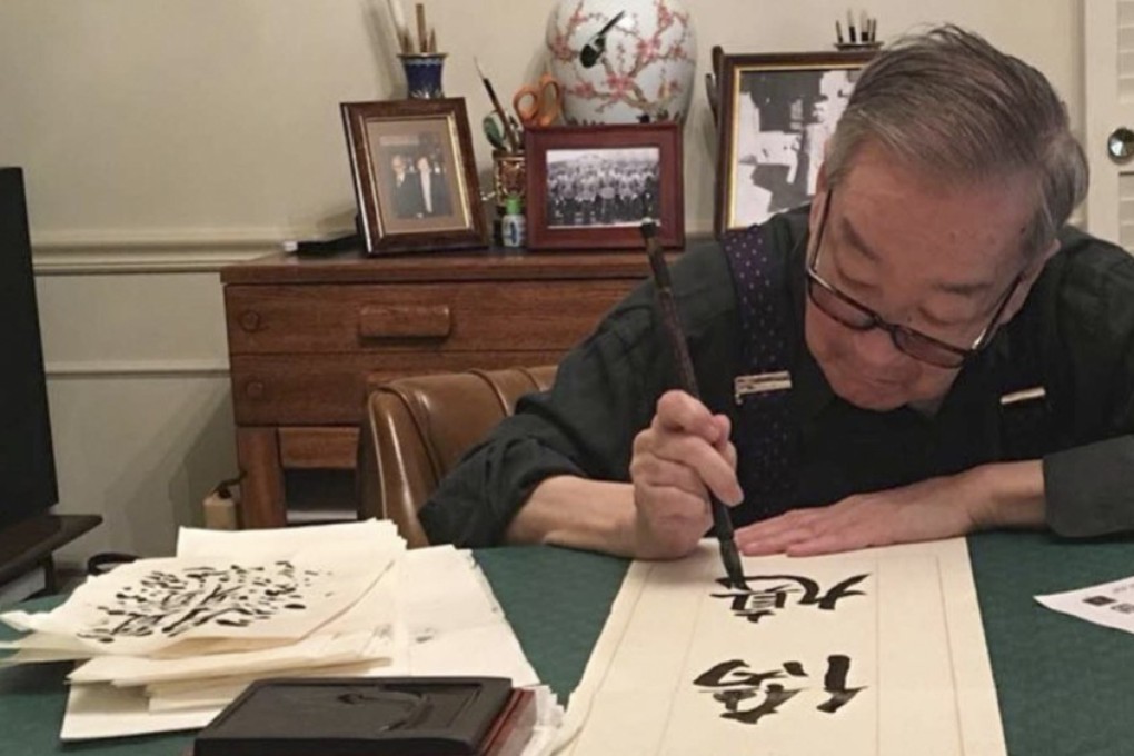 Professor Chi Wang, a scholar and collector of Chinese art, practising calligraphy. Photo: courtesy of Professor Chi Wang