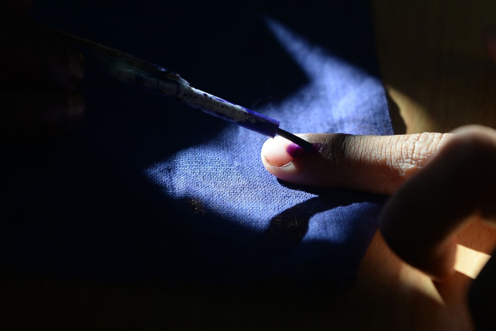 An Indian voter gets his finger marked with ink as he votes at a polling station in Chennai, during the second phase of the mammoth Indian elections. Photo: AFP