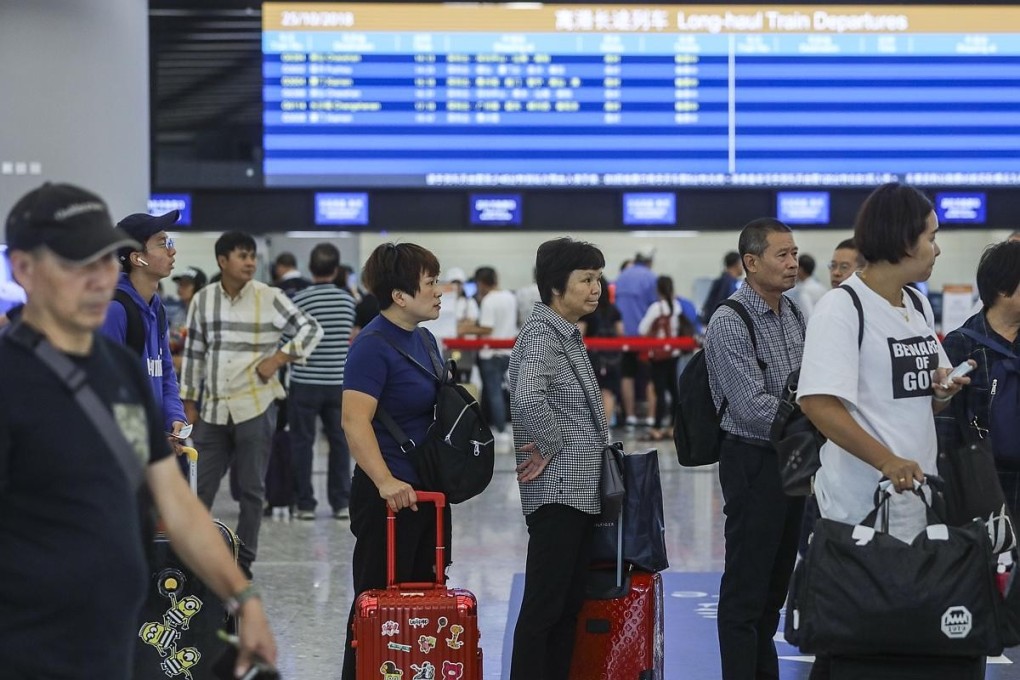 Passengers queue up to buy advanced tickets at West Kowloon terminus. Photo: Sam Tsang