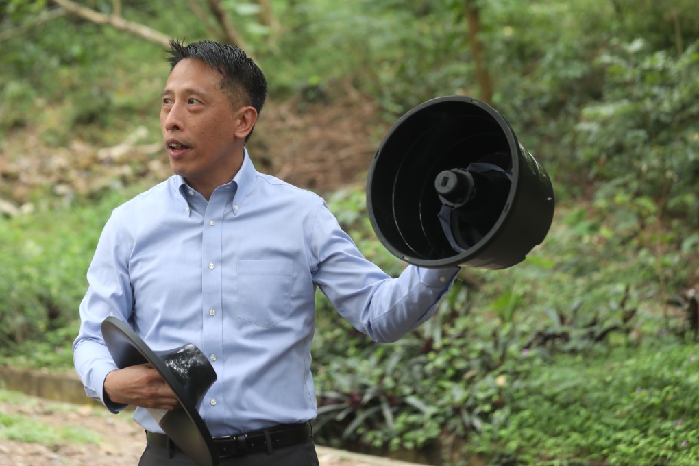 Lee Ming-wai, a Food and Environmental Hygiene Department official, with one of the new traps in Po Lam. Photo: Xiaomei Chen