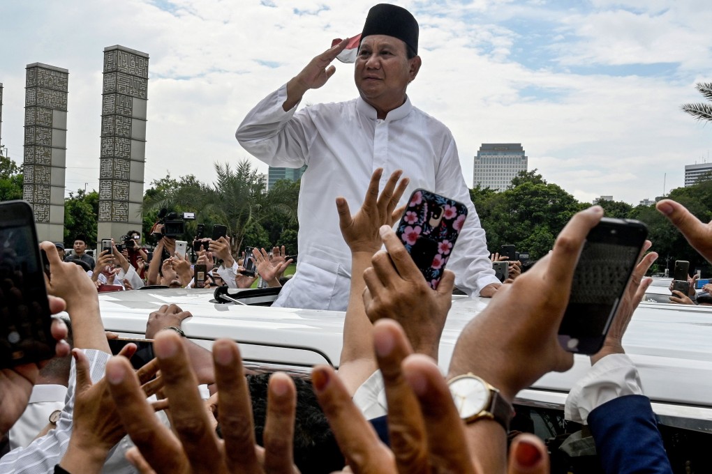 Prabowo Subianto gestures to supporters as he leaves a mosque after Friday prayers in Jakarta. Photo: AFP
