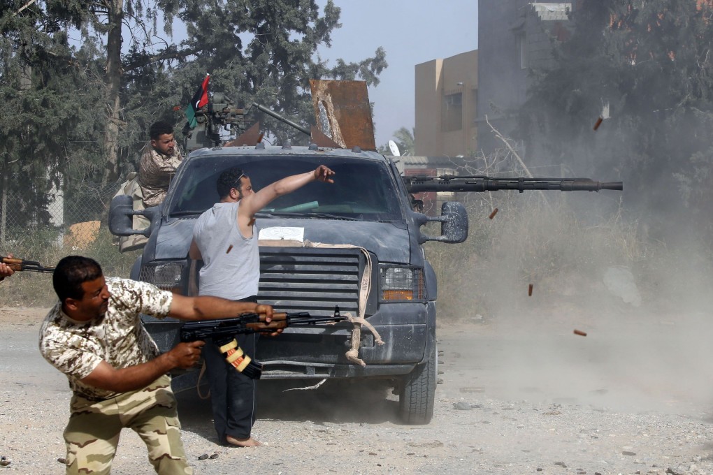 Libyan fighters loyal to the Government of National Accord (GNA) fire their guns during clashes with forces loyal to strongman Khalifa Hifter south of the capital Tripoli's suburb of Ain Zara. Photo: AFP