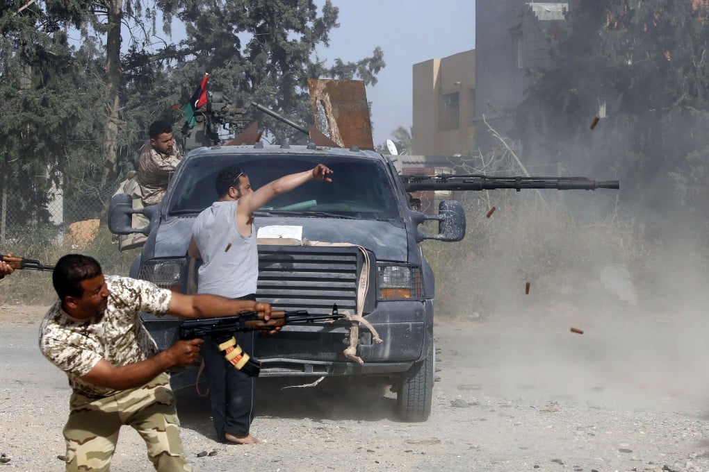 Libyan fighters loyal to the Government of National Accord (GNA) fire their guns during clashes with forces loyal to strongman Khalifa Hifter south of the capital Tripoli's suburb of Ain Zara. Photo: AFP
