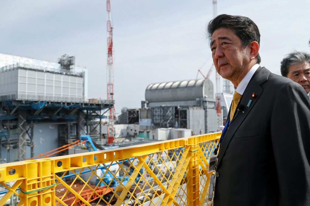 Japan's Prime Minister Shinzo Abe cut an assured image in a suit during a recent visit to the Fukushima Dai-ichi nuclear power plant, a contrast to his last trip in 2014 when he wore protective head-to-toe clothing to guard against radiation. Photo: AFP