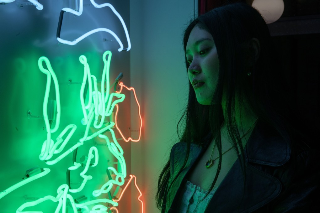 Faye Wei Wei with her artwork Frail Silver of the Climbing Stars.